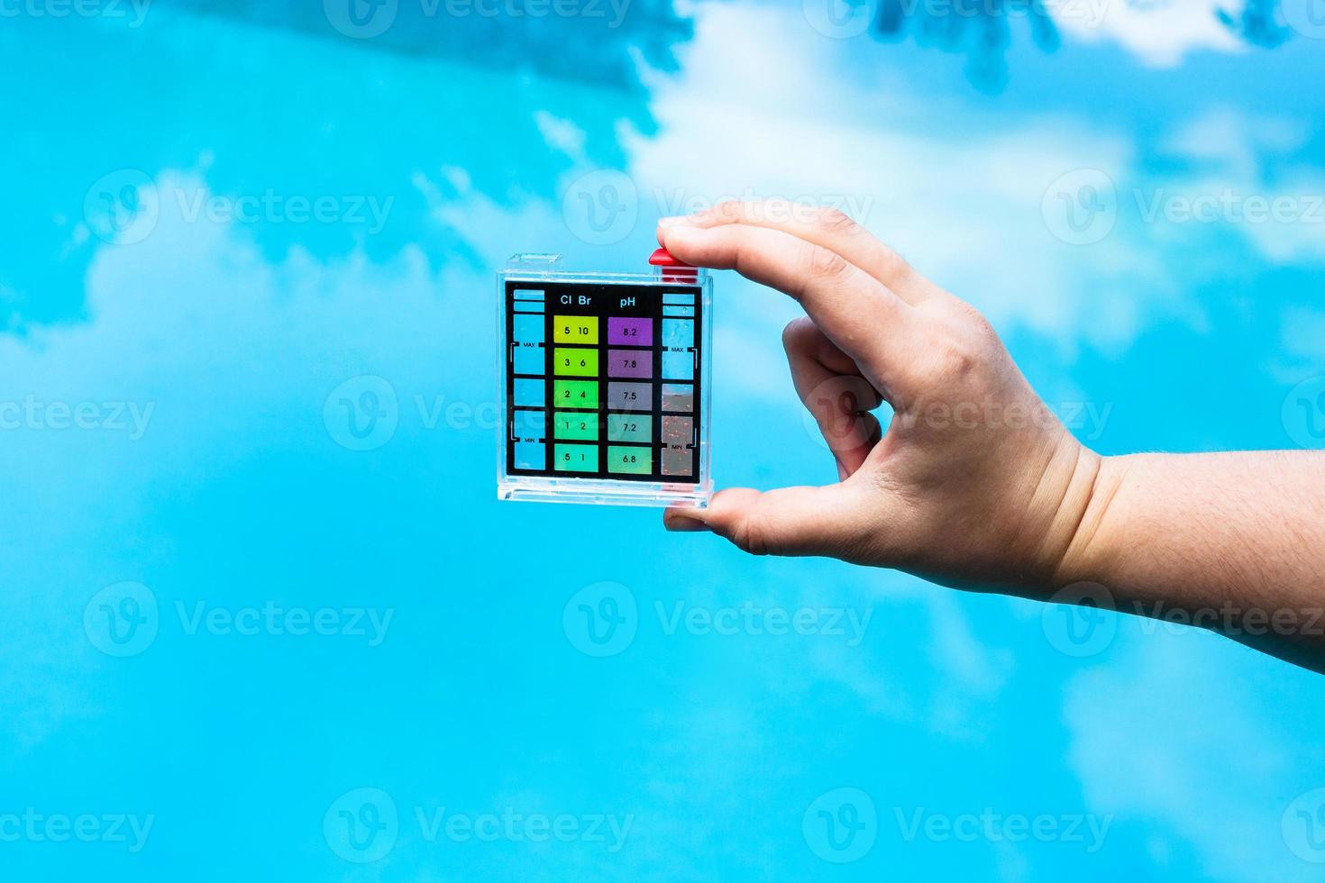 hand holds pH indicator for measure the acidity photo