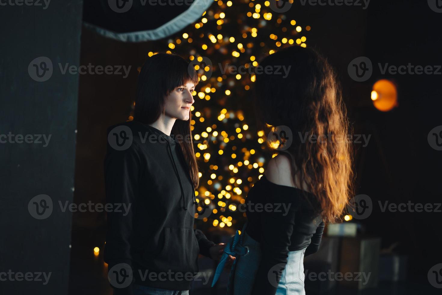 Two girls dancing on camera in the studio photo