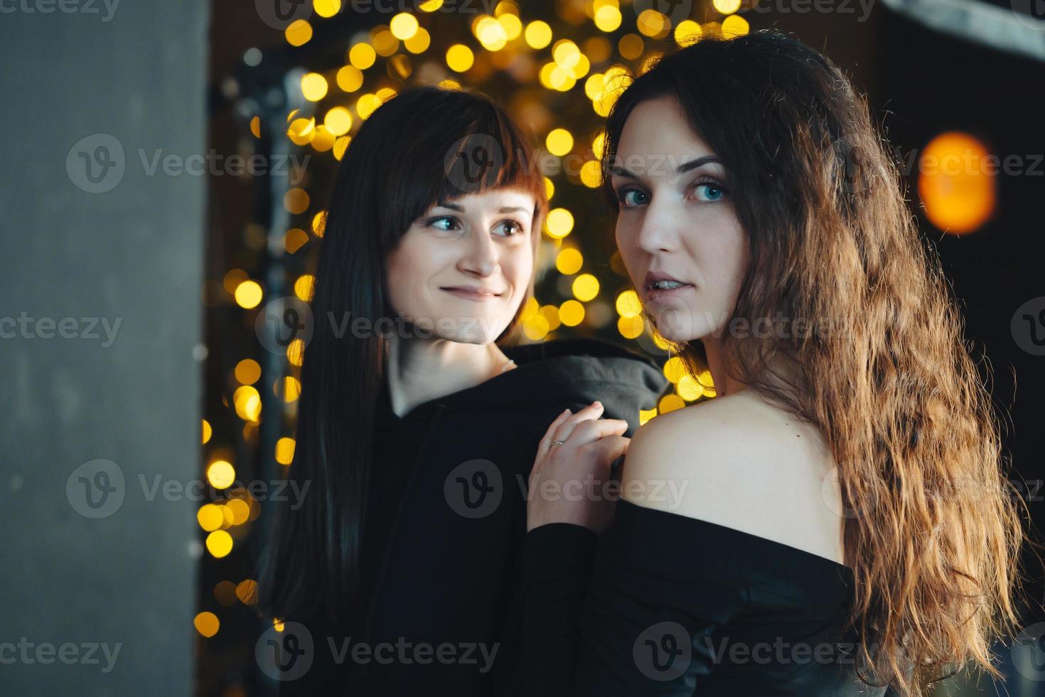 Two girls in each other's tender embraces photo