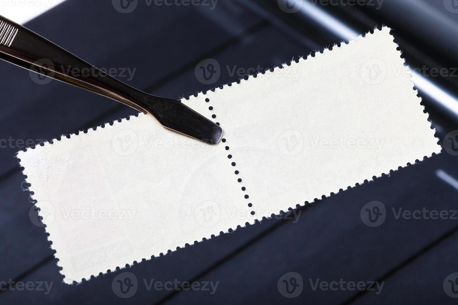 tongs keep double postage stamp with blank back photo