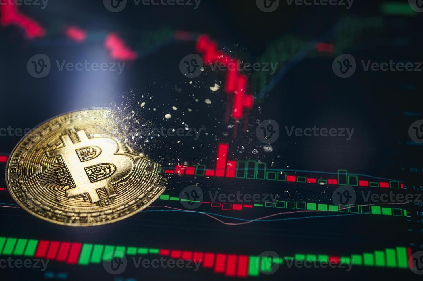 Crypto currency golden coin. Gold bitcoin falling apart. Concept of a cryptocurrency market crisis and defocused chart background. photo