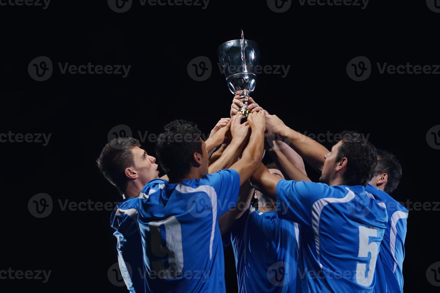 soccer players celebrating victory photo