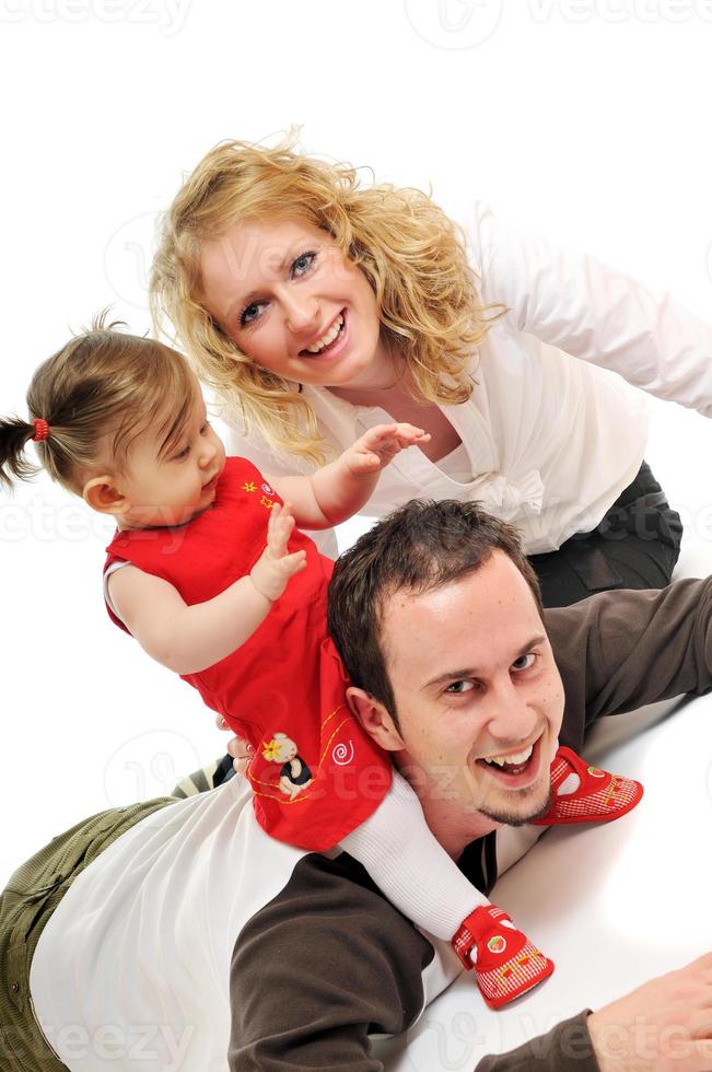 happy young family together in studio photo