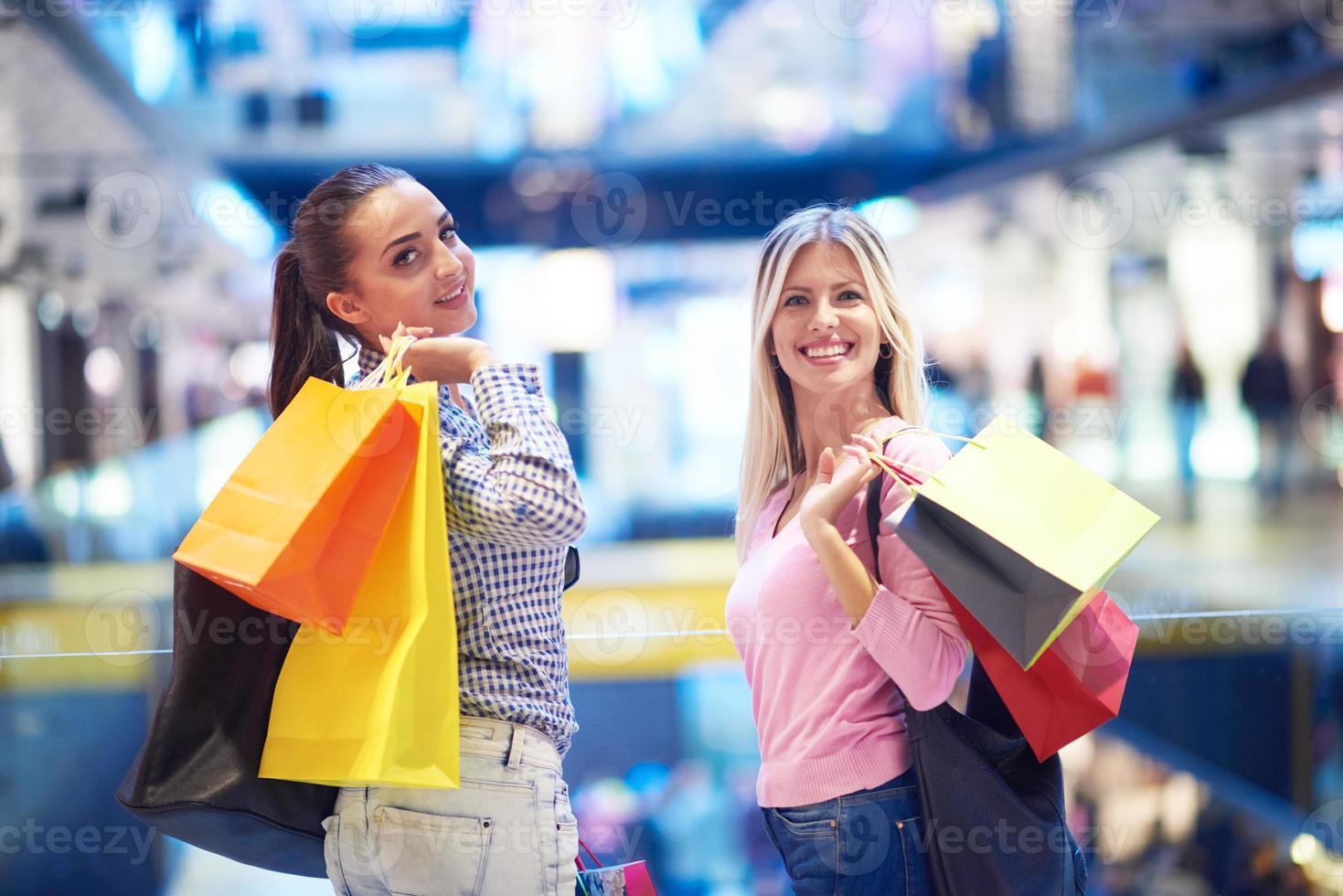 happy young girls in shopping mall 11402707 Stock Photo at Vecteezy