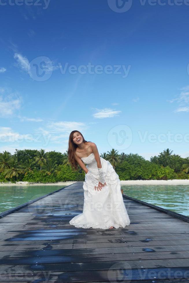 asian bride on beach photo