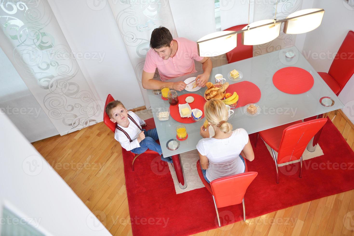family have healthy breakfast at home photo