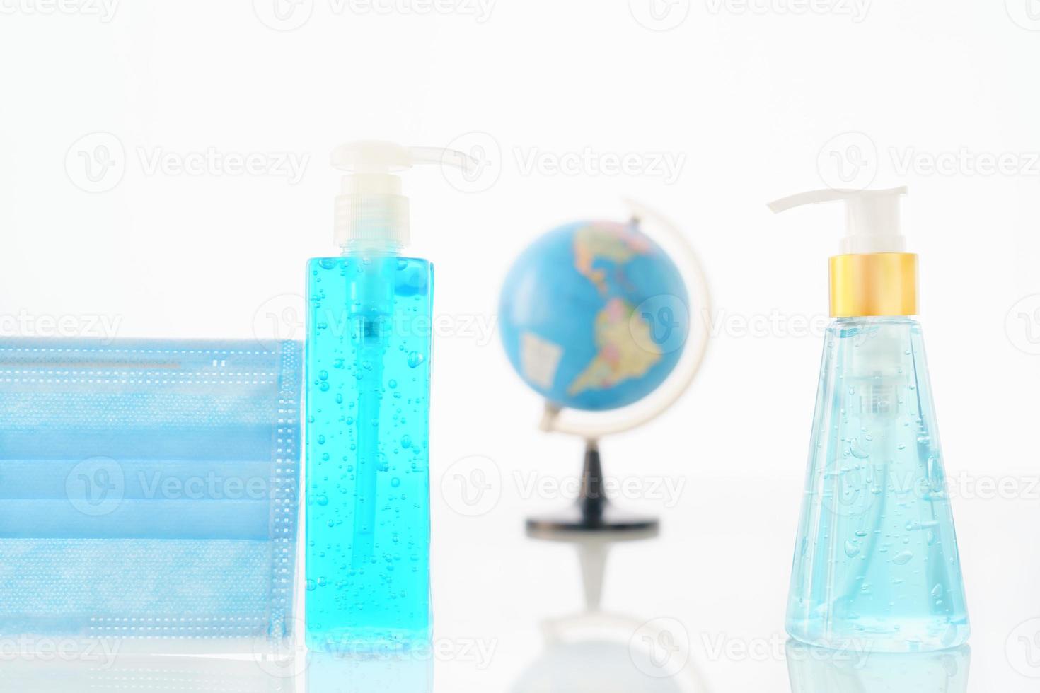Alcohol gel bottle sanitizer hand and Medical face masks photo