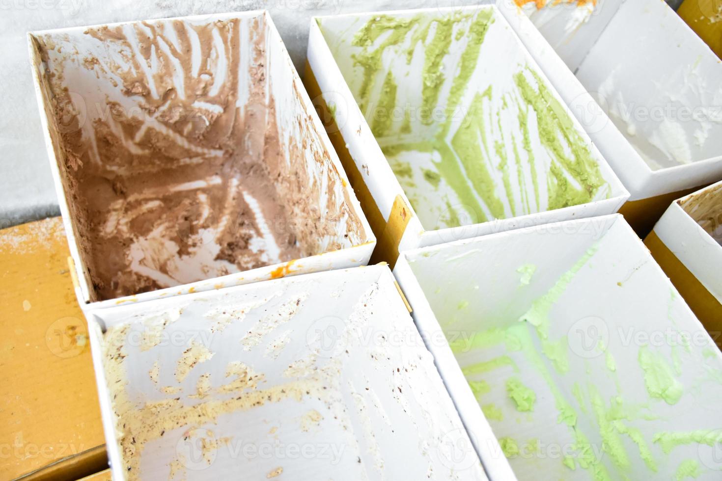 Boxes of various flavor ice cream in the freezer which had sold out and empty, soft and selective focus. photo