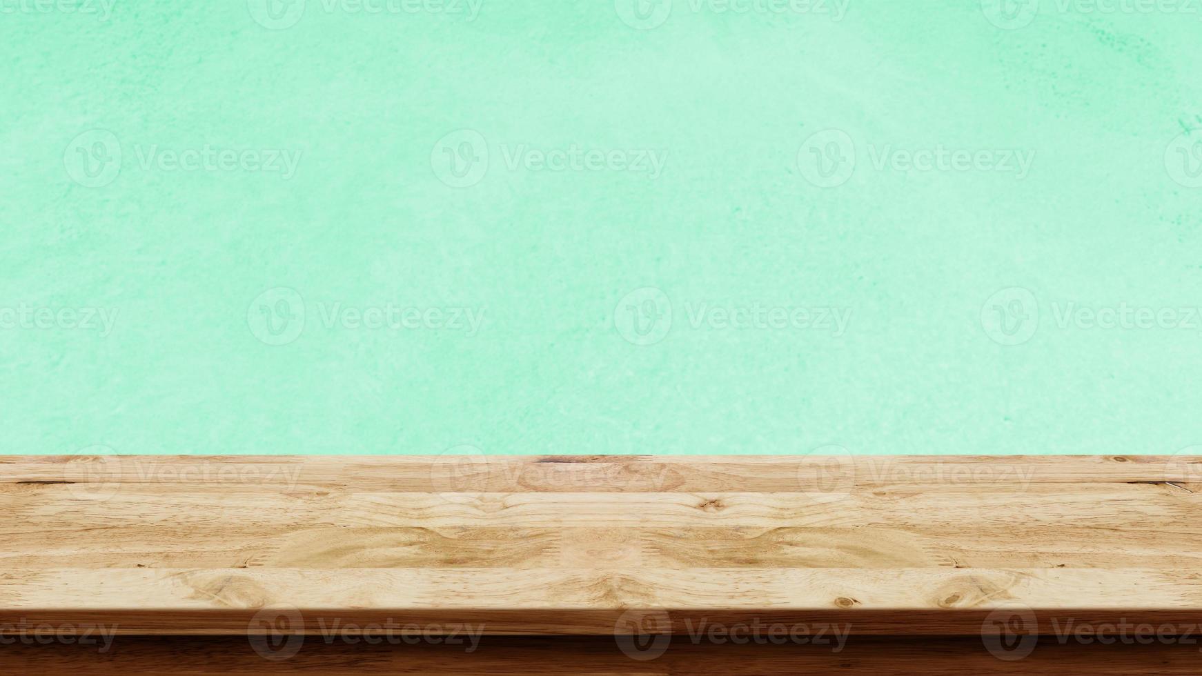 Empty wooden table with green wall background. Kitchen mock up for design. photo