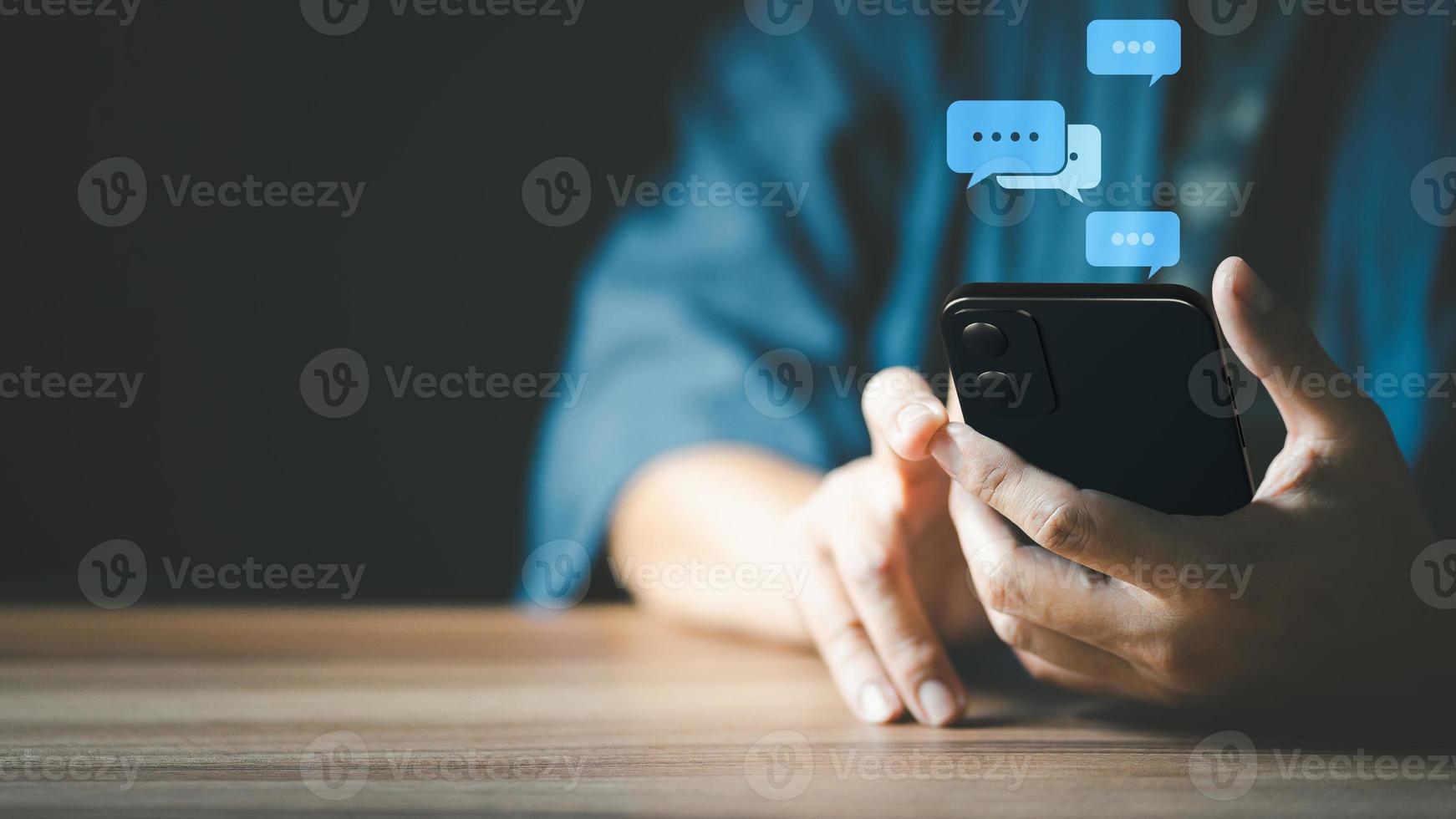 Man hand using smartphone typing live chat chatting on application communication digital web and social network concept. Social media application chat box. photo