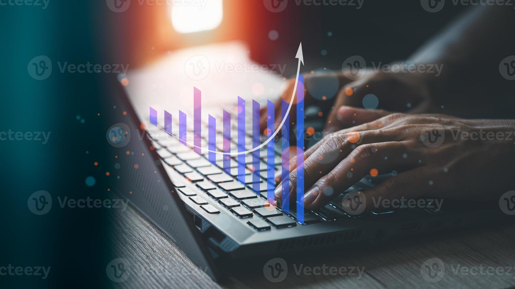 Charts from laptop with analysis of financial, technology, banking and investment concepts, businessman use laptop computer to work. photo
