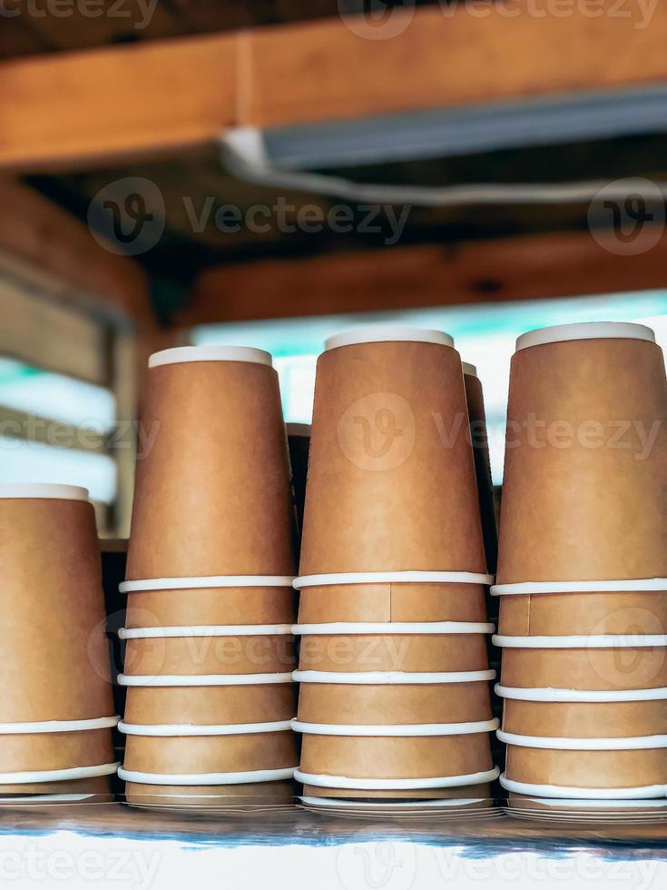 Disposable coffee cups in street market cafe photo