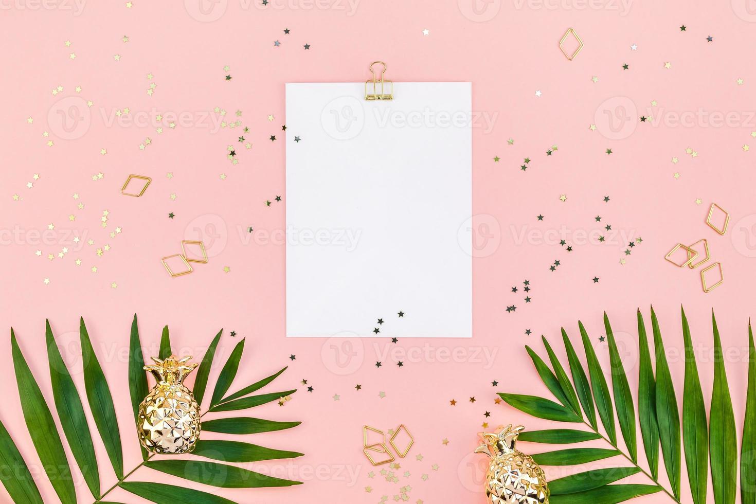 Clip board mock up with green tropical leaves photo