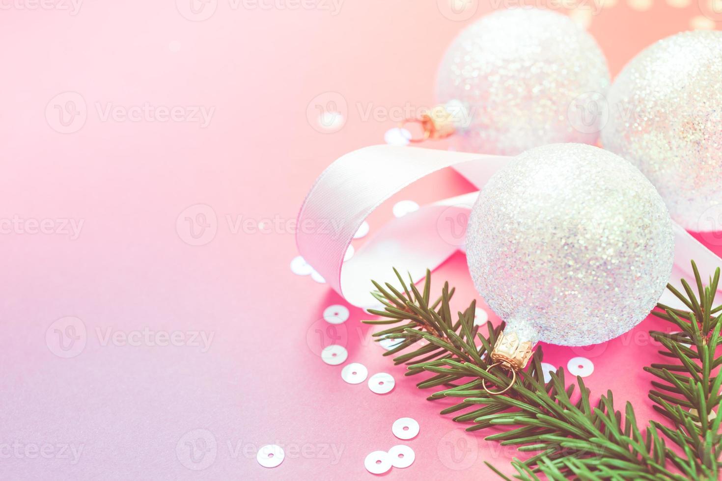 Christmas pearl decoration balls pink background photo