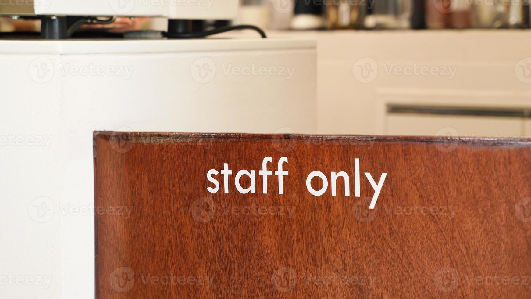 Close up of staff only sign at the wooden door cafe or restaurant photo