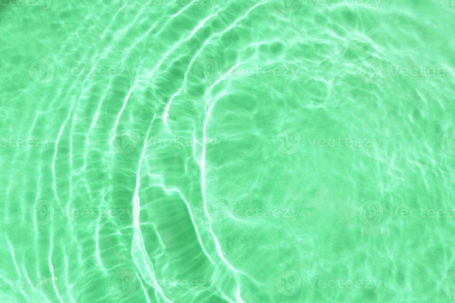 Realistic natural water wave overlay for background, blurred transparent green colored water surface texture with splashes and bubbles, trendy abstract background photo