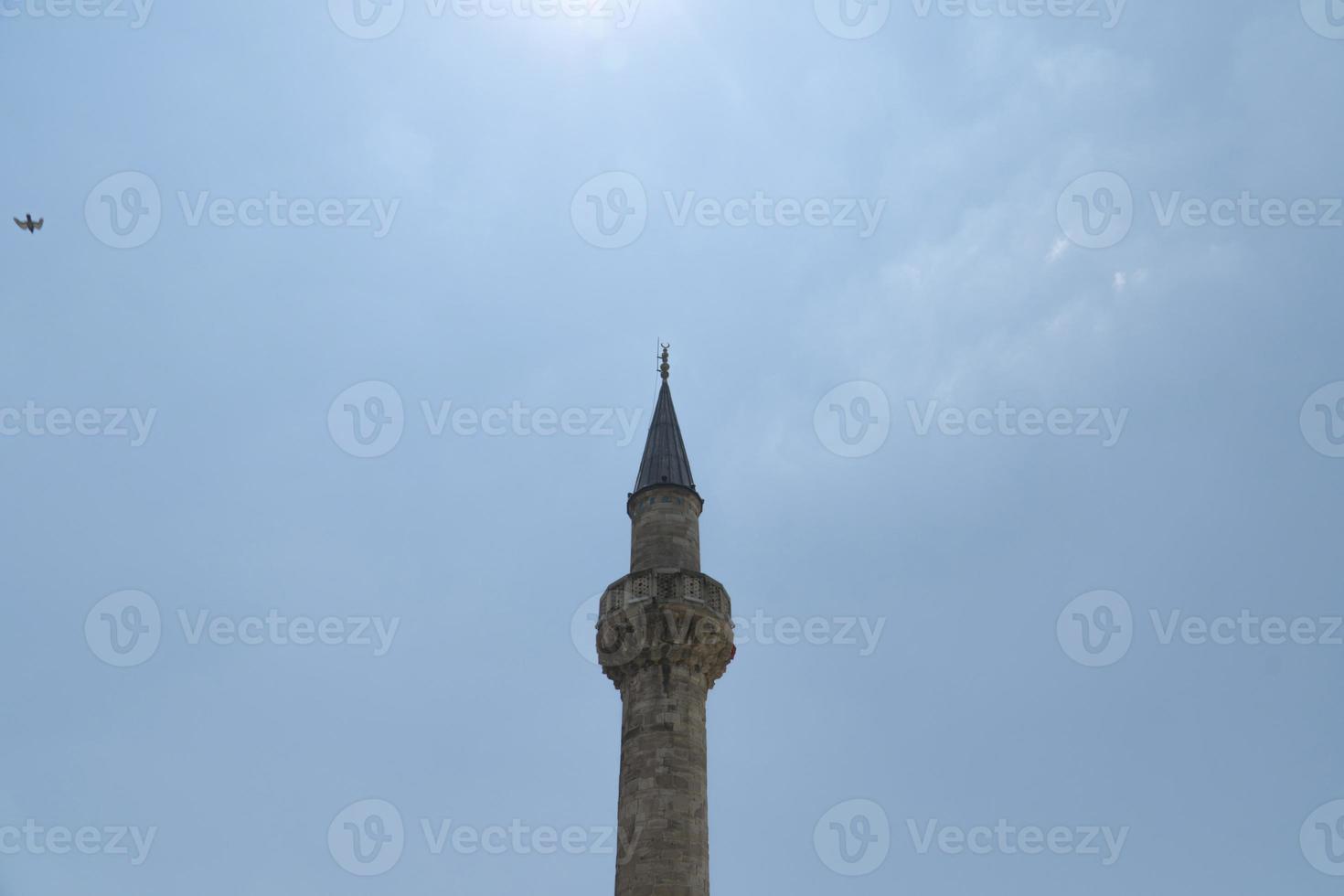 mosque minaret and blue sky photo