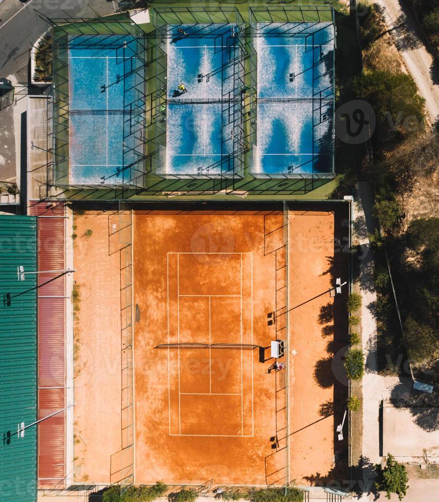 Aerial top down drone view of tennis and padel courts in a public sporting area photo