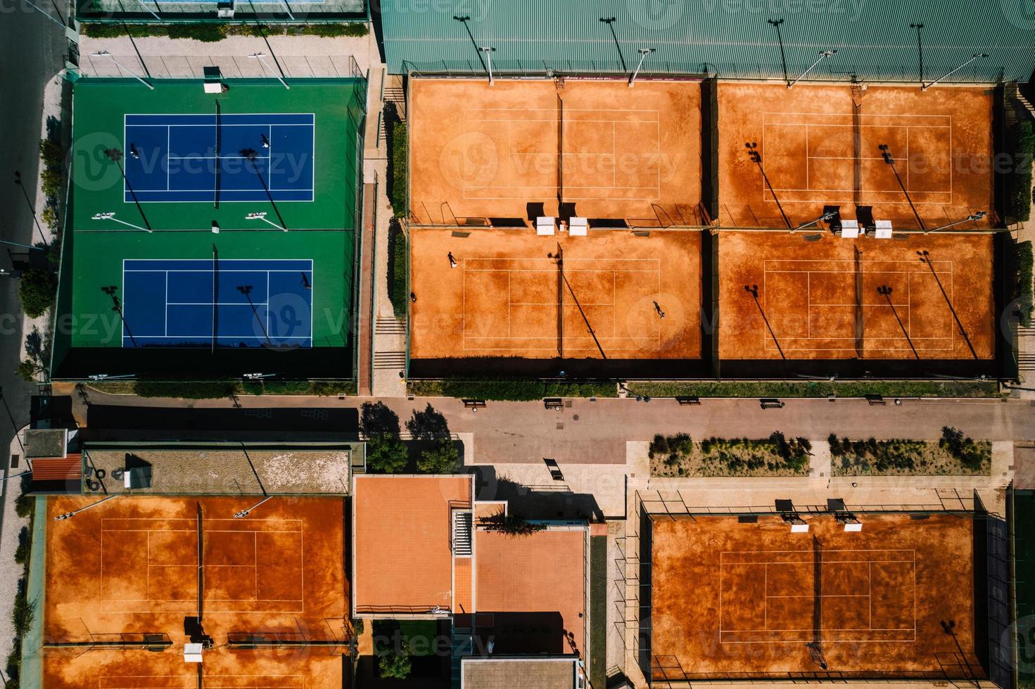 Aerial top down drone view of tennis and padel courts in a public sporting area photo
