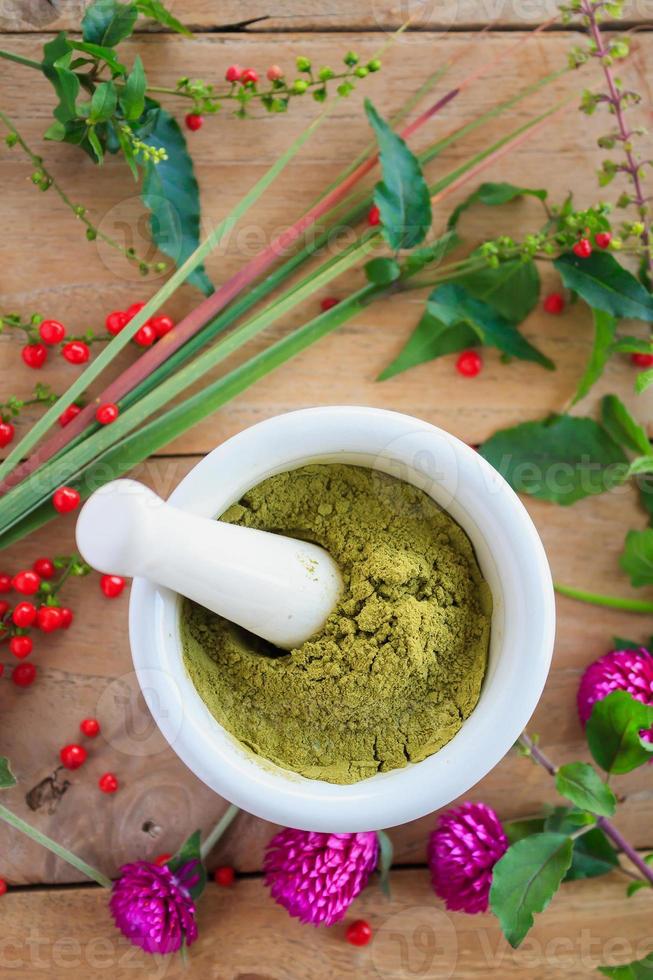 Fresh herbs powder in the mortar, alternative medicine photo