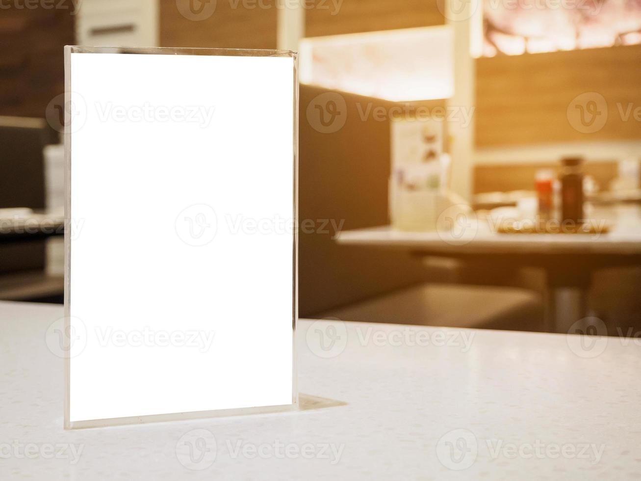 Mock up menu frame on table in the cafe restaurant photo