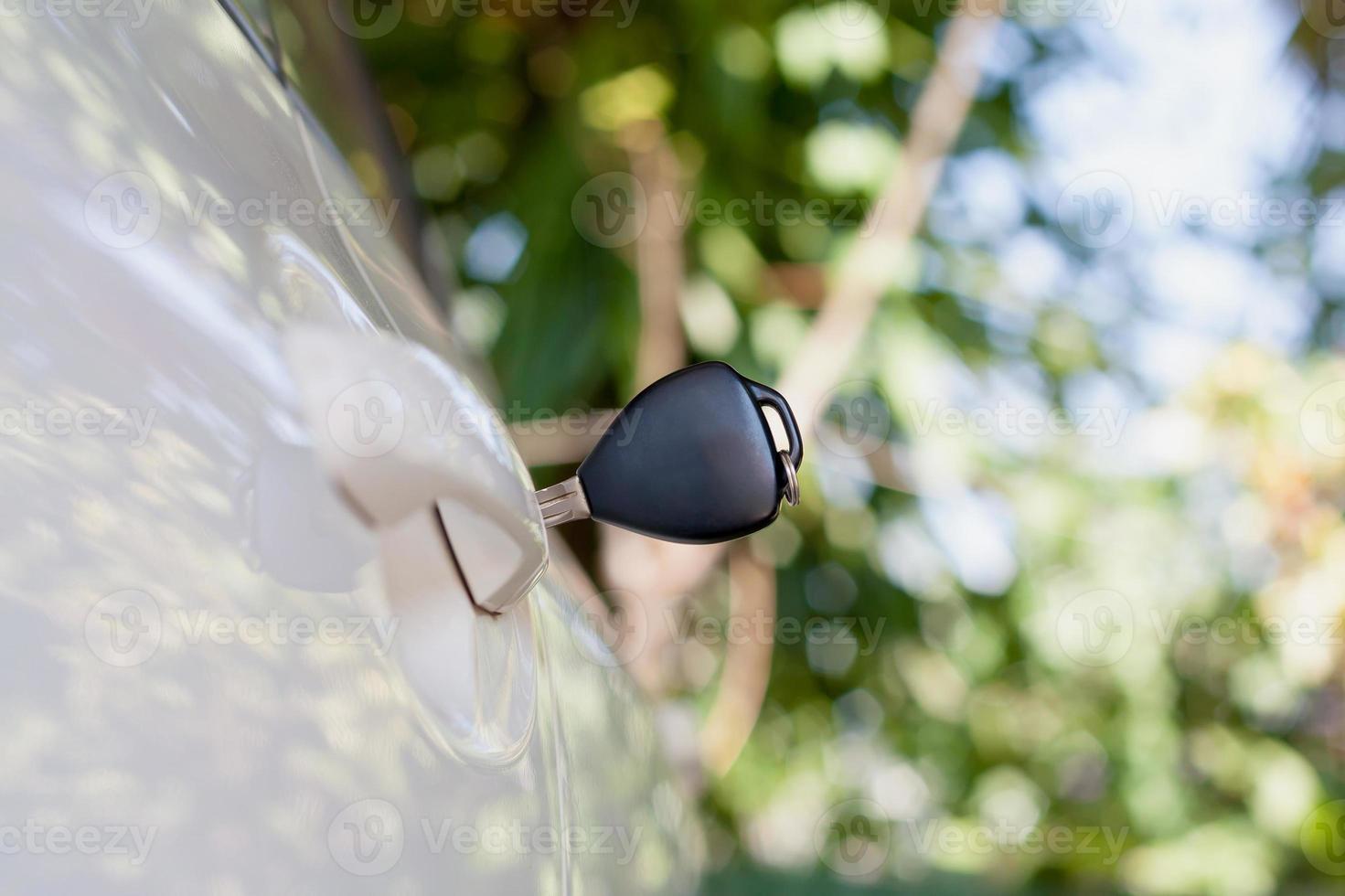 Car keys left in the car door photo