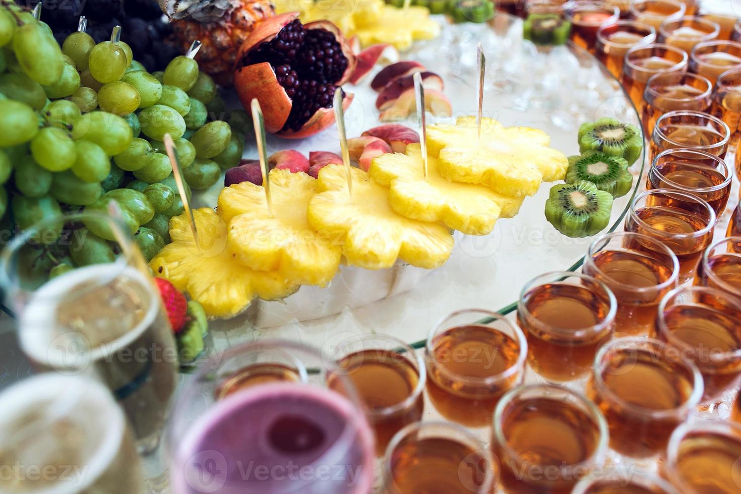 Rich buffet, whiskey, bourbon, champagne, wine and fruit. photo