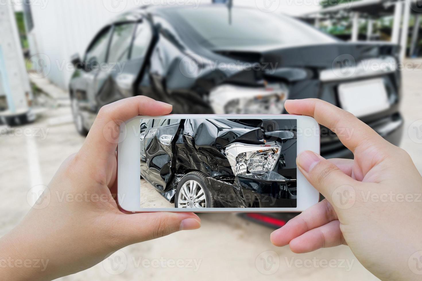 Car crash accident damaged with hand using smartphone taking photo