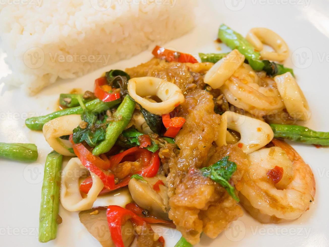 Rice with stir-fried seafood and basil photo
