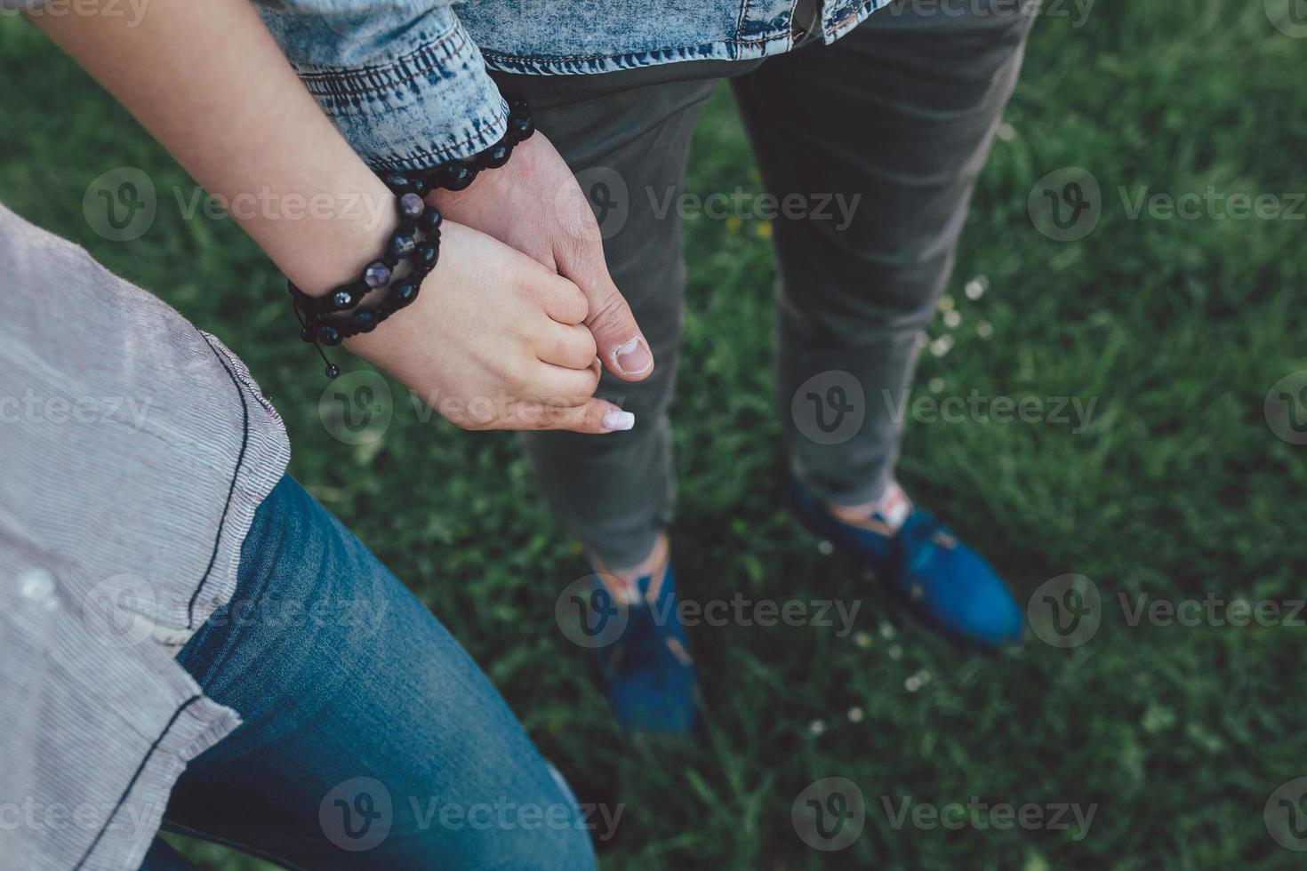 Happy couple holding hands photo