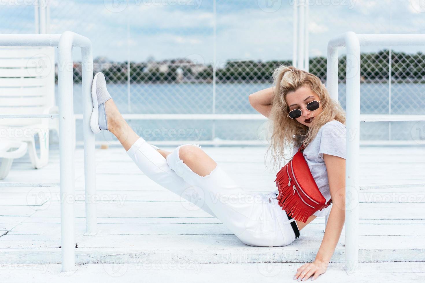Blonde woman with a bag photo