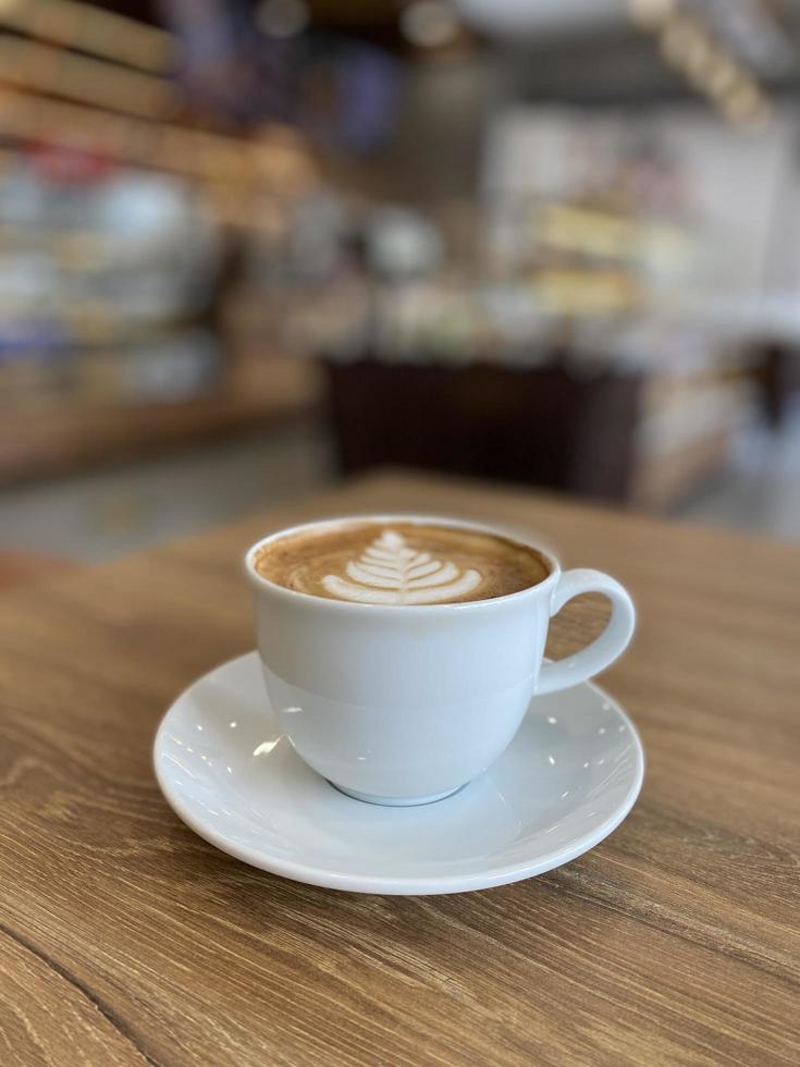 Hot coffee cup on table photo