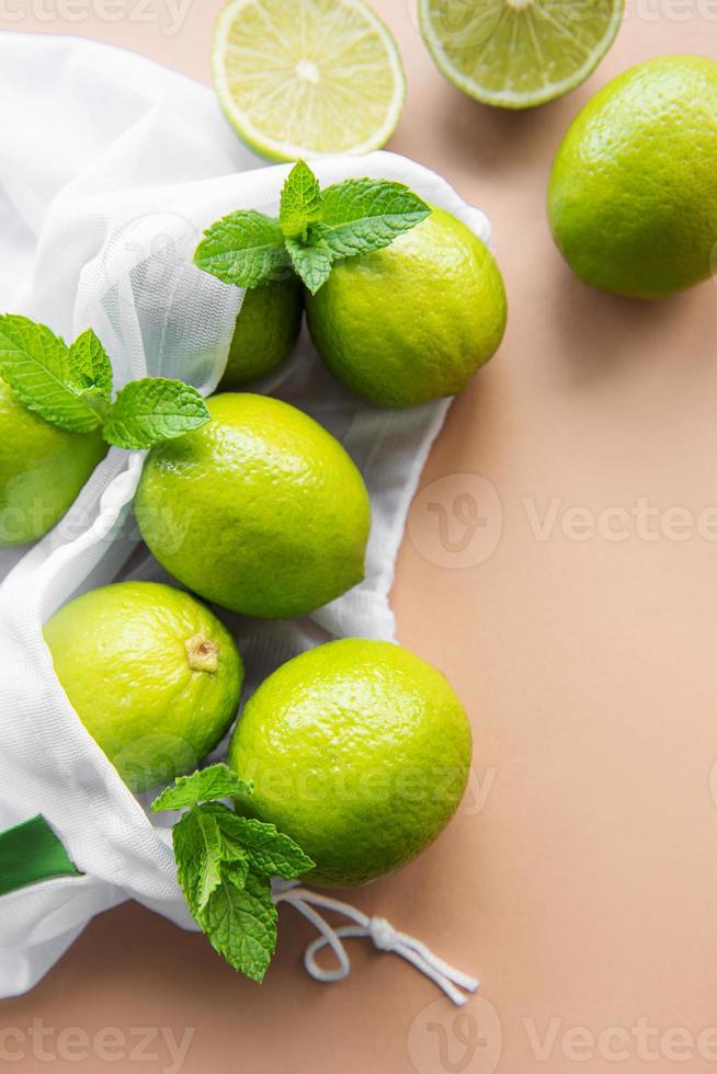 Eco-friendly bag with ripe  limes photo