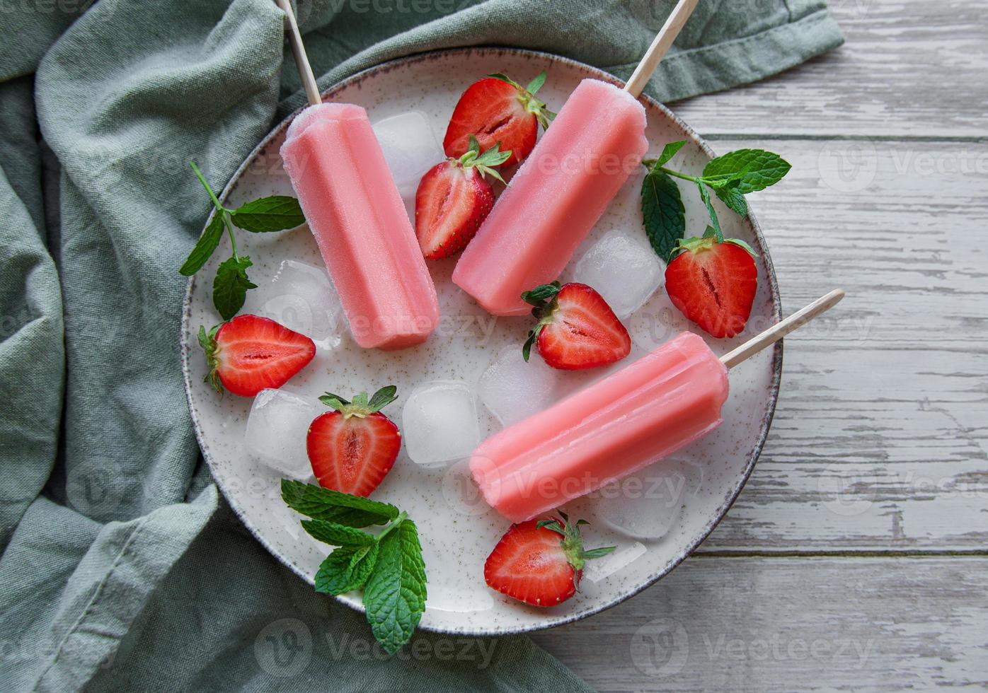 Strawberry ice cream popsicles photo