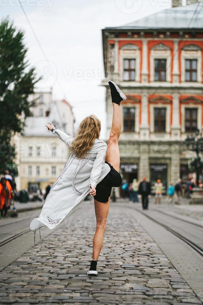 beautiful young girl lifted her leg up photo