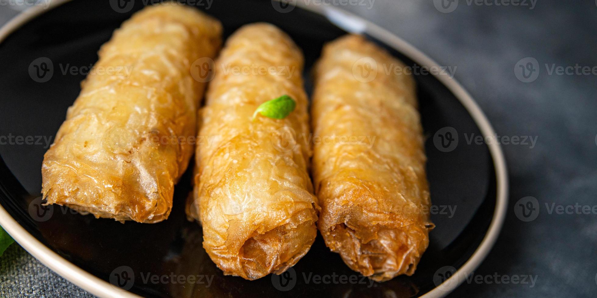 Nem asian food meat vegetable nems spicy sauce cuisine deep fried spring rolls fresh meal on the table copy space photo