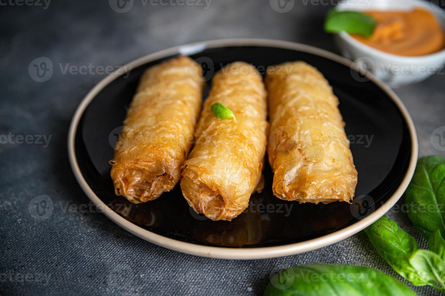 Nem asian food meat vegetable nems spicy sauce cuisine deep fried spring rolls fresh meal on the table copy space photo
