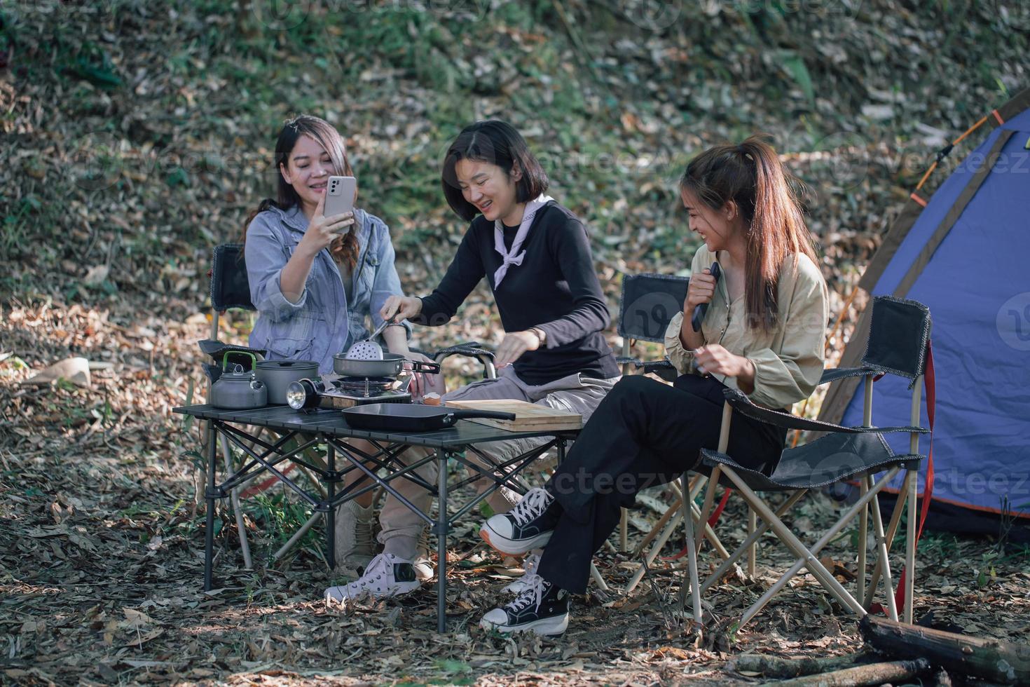 three bestie go camping in the forest photo