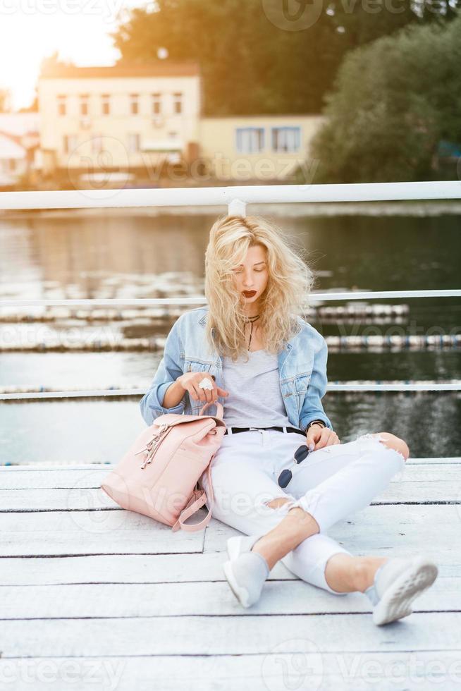 Blonde woman with a bag photo