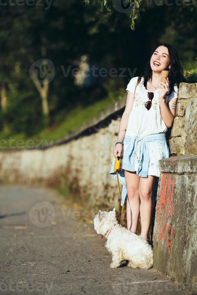 Girl with ice cream and dog photo