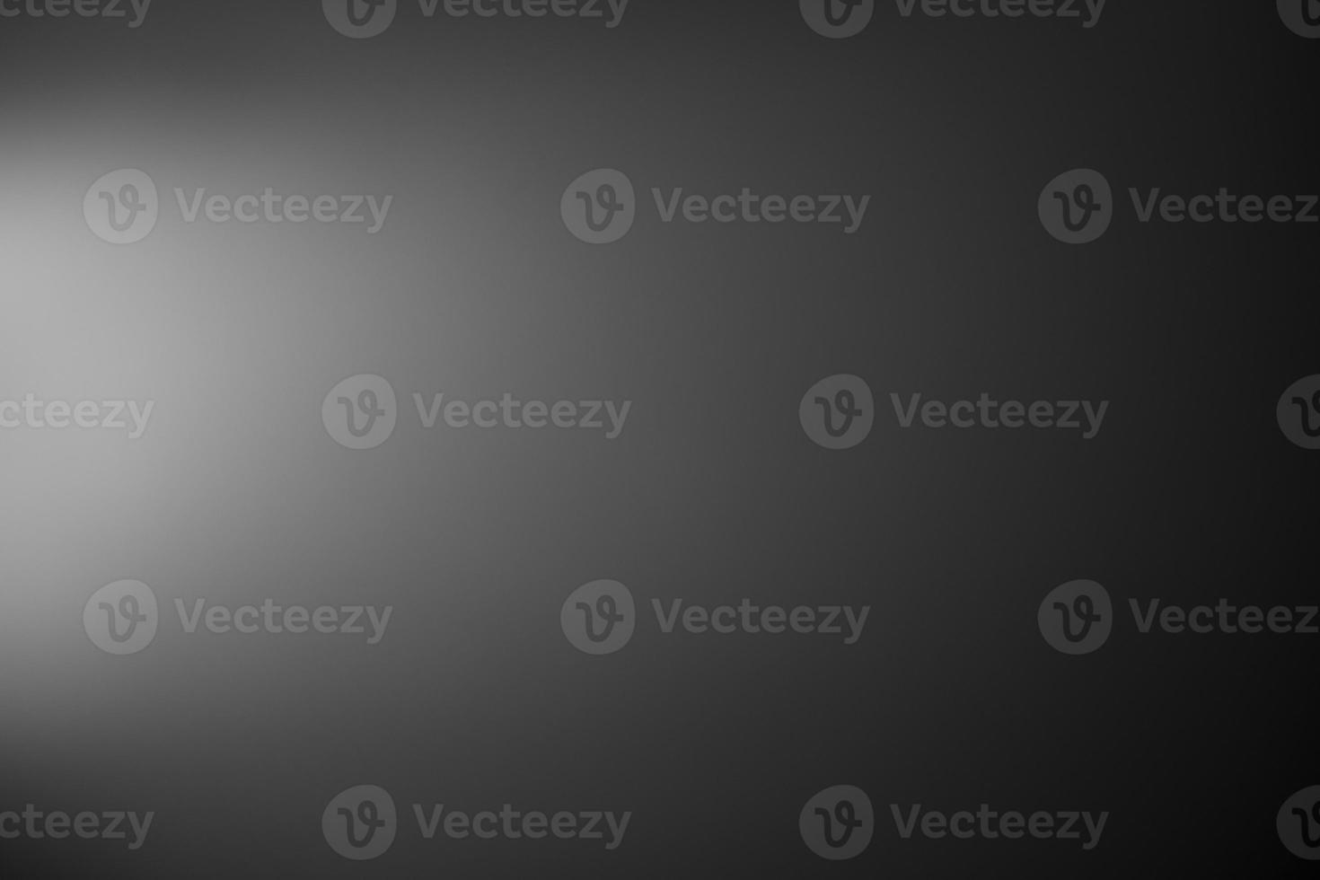 Dark black and gray blurred background has a little abstract light. soft background for wallpaper,design,graphic and presentation photo