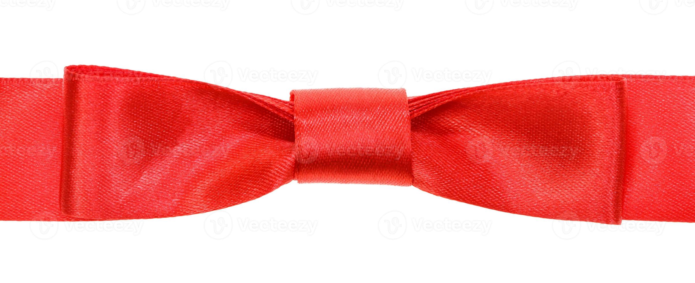 real red bow knot on wide satin tape isolated photo