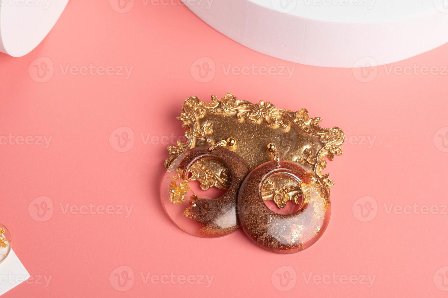 Heart-shaped earrings made of resin, handmade jewelry. photo