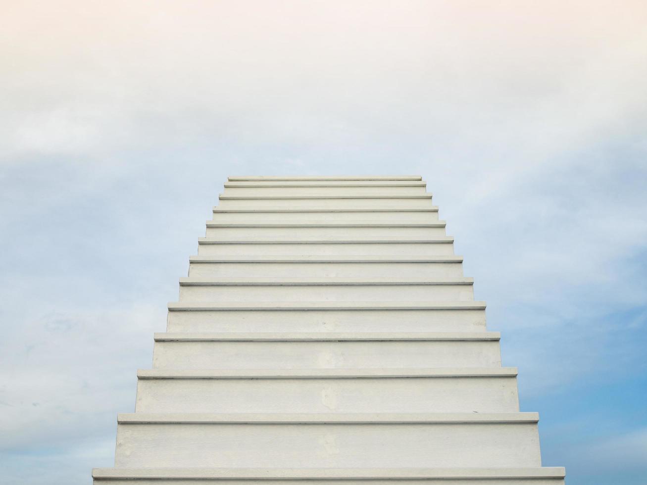 A white staircase stretches up the horizon. That means to be success or go to heaven. photo