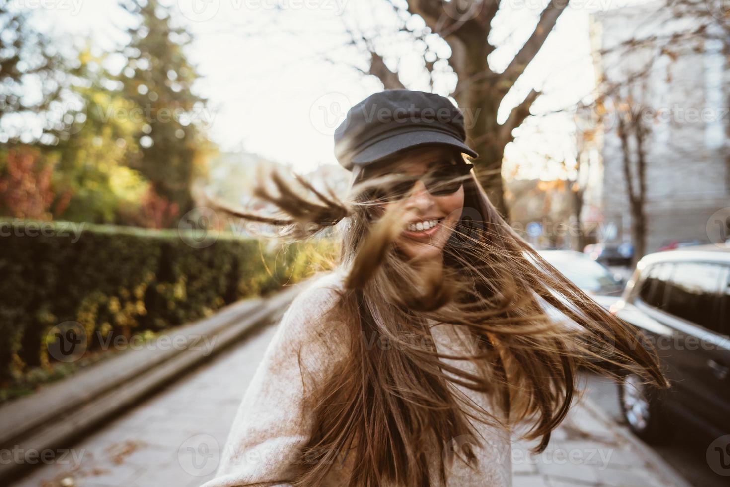 Street portrait of young beautiful fashionable woman photo