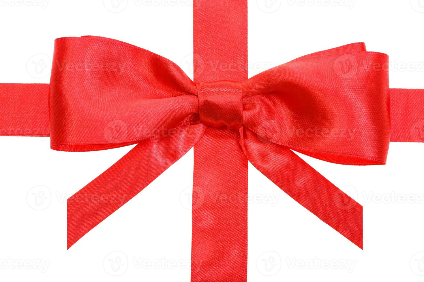 real red bow with vertical cuts on ribbon close up photo