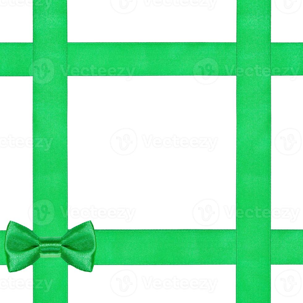 green bow knot on four satin ribbons isolated photo