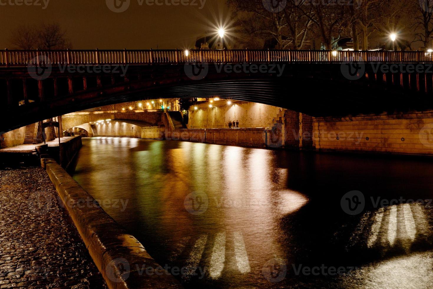 bridge and Seine river at night, Paris photo