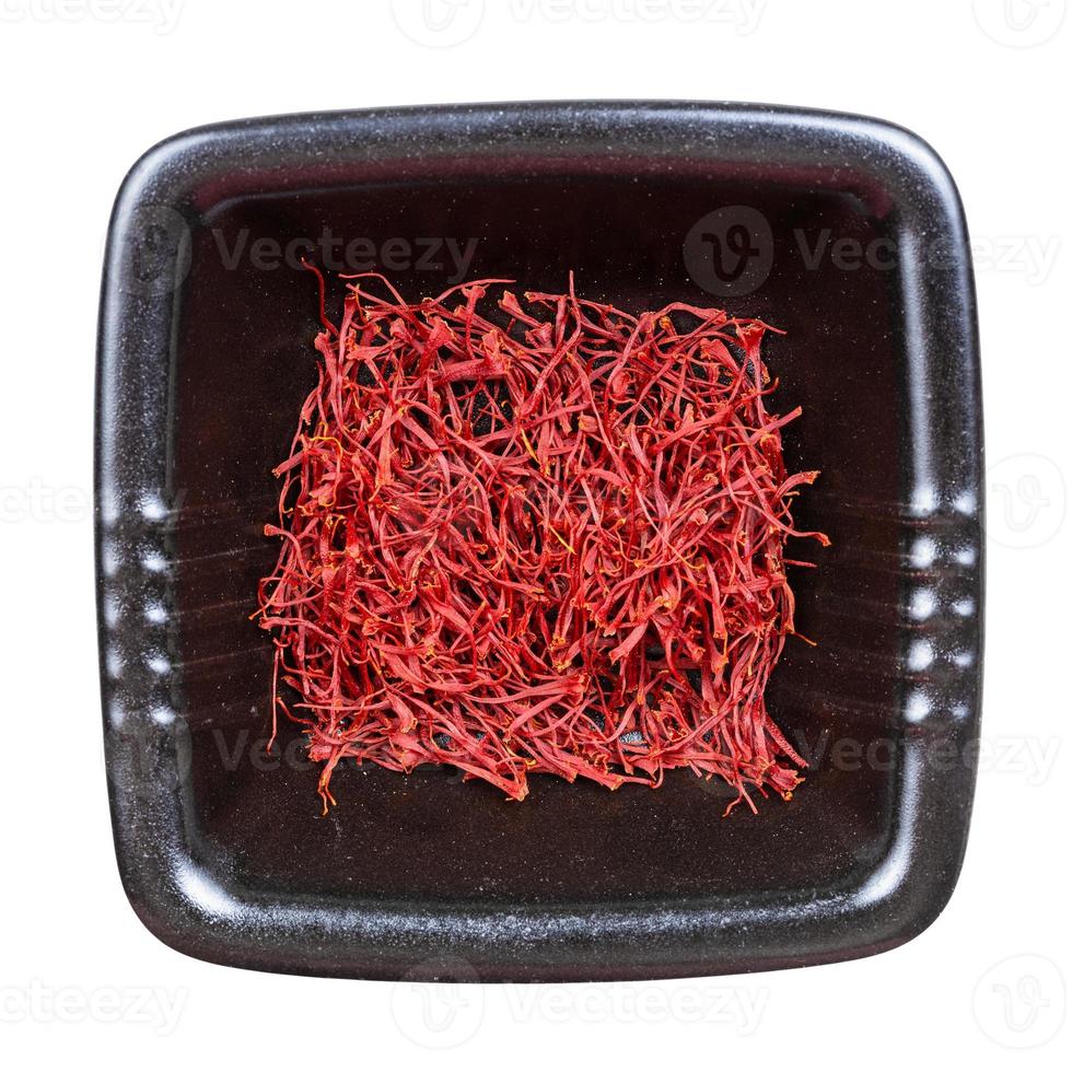 top view of crocus saffron threads in black bowl photo