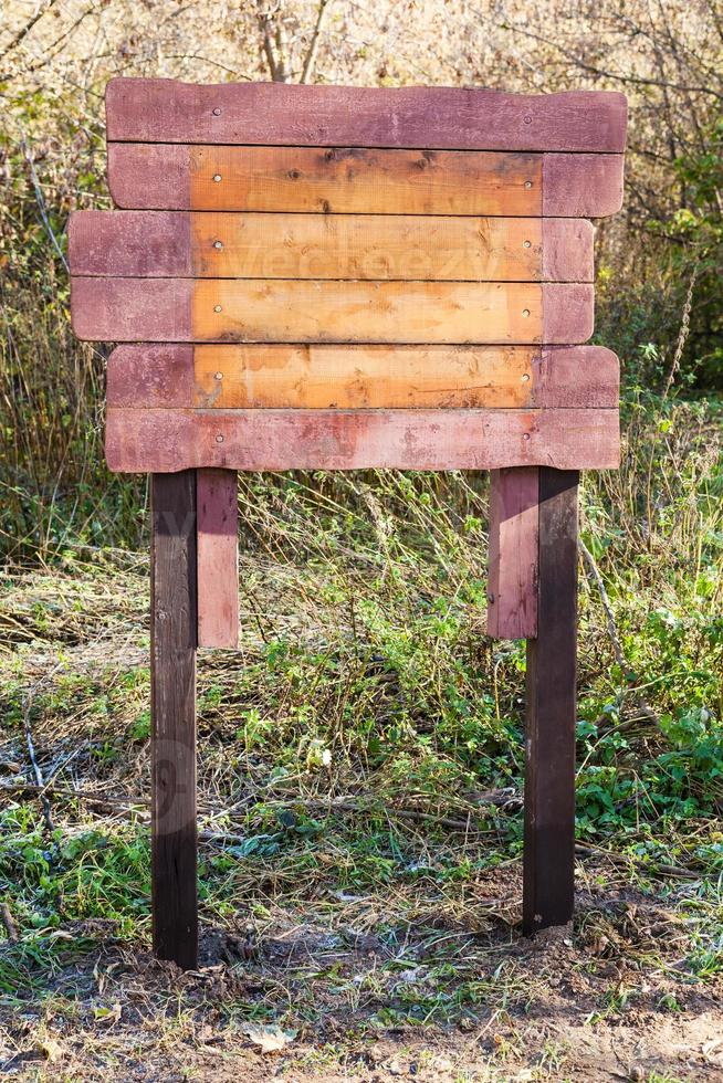 empty wooden outdoor pointer in urban park photo